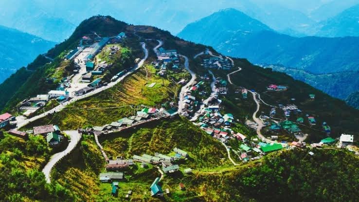 Tourists overlook Gangtok city while mountain roads remain affected by conditions that contributed to a decline in domestic visitor arrivals.