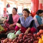 Women vendors serve customers at the bustling Ima Keithel market in Imphal as record weekend trade signals renewed economic activity and community confidence.