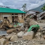 Emergency responders assess a flood-affected village near Itanagar as search efforts continue after two women were reported missing following a flash flood.