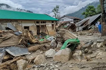 Emergency responders assess a flood-affected village near Itanagar as search efforts continue after two women were reported missing following a flash flood.