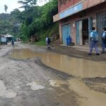 A deteriorated road with extensive potholes along the Akuluto–Mokokchung transport corridor in Nagaland.