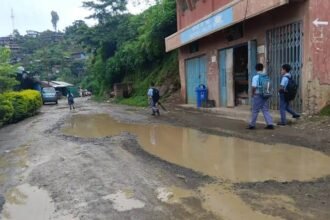 A deteriorated road with extensive potholes along the Akuluto–Mokokchung transport corridor in Nagaland.