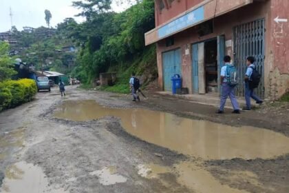 A deteriorated road with extensive potholes along the Akuluto–Mokokchung transport corridor in Nagaland.