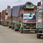 Trucks remain stranded along a Manipur highway as the United Naga Council intensifies its indefinite economic blockade.