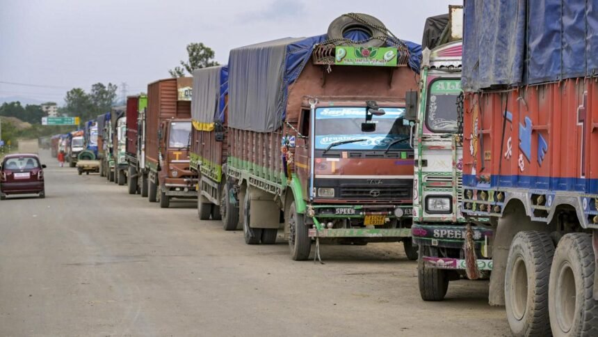 Trucks remain stranded along a Manipur highway as the United Naga Council intensifies its indefinite economic blockade.