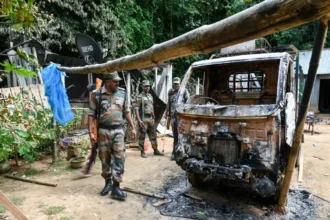 Police and protesters face a tense situation near a returnee demonstration site in Jirania, Tripura.