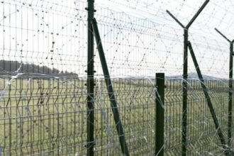 Security fencing along Tripura’s international border with Bangladesh representing the state’s extensive border infrastructure.