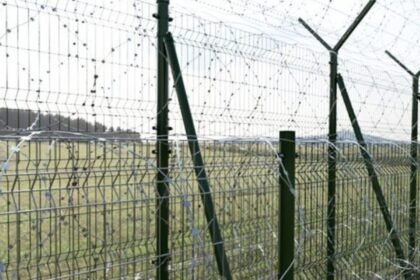 Security fencing along Tripura’s international border with Bangladesh representing the state’s extensive border infrastructure.