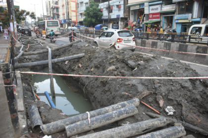 Urban infrastructure development in Guwahati featuring drainage improvement works and flyover construction projects.