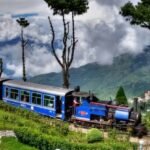 Darjeeling Himalayan Railway Toy Train travelling through the scenic Himalayan hills after Lonely Planet recognition