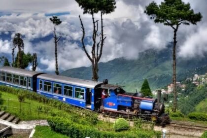 Darjeeling Himalayan Railway Toy Train travelling through the scenic Himalayan hills after Lonely Planet recognition